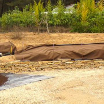 Réalisation de restanques en pierre sèche - Pendant les travaux